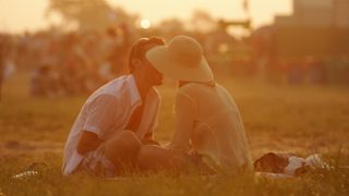 A picture of a couple at a music festival