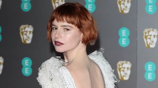 Jessie Buckley with a short bob with French girl bangs