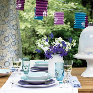 Table setting and flowers on an outdoor table