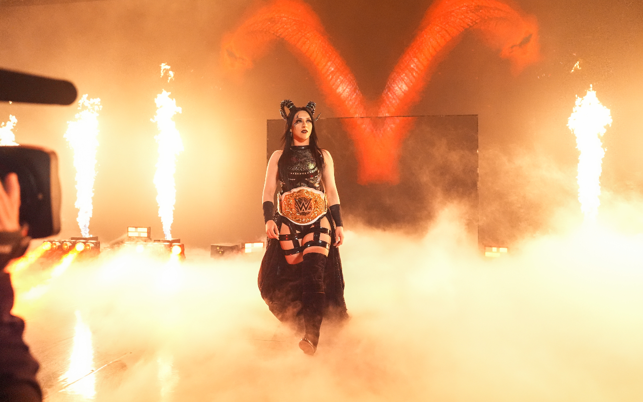 Stephanie Vaquer walking to the ring, surrounded by smoke and fire