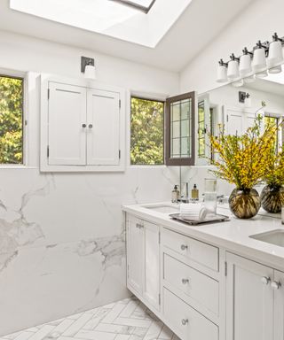 a white marble bathroom at Katharine McPhee's home