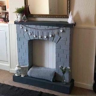 room with fireplace which is made using cardboard