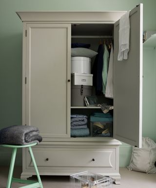 wardrobe with door open revealing shelves