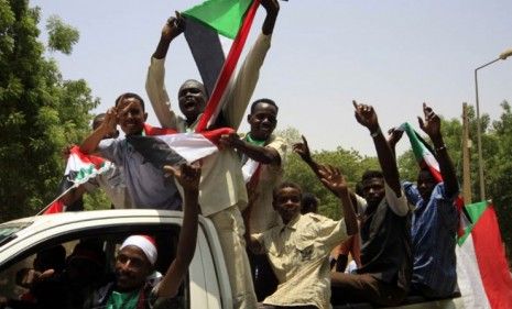 South Sudanese fly the country&amp;#039;s new flag and celebrate the recent secession. 