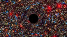 A NASA simulation shows a supermassive black hole at the center of a galaxy. 