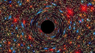 A NASA simulation shows a supermassive black hole at the center of a galaxy. 