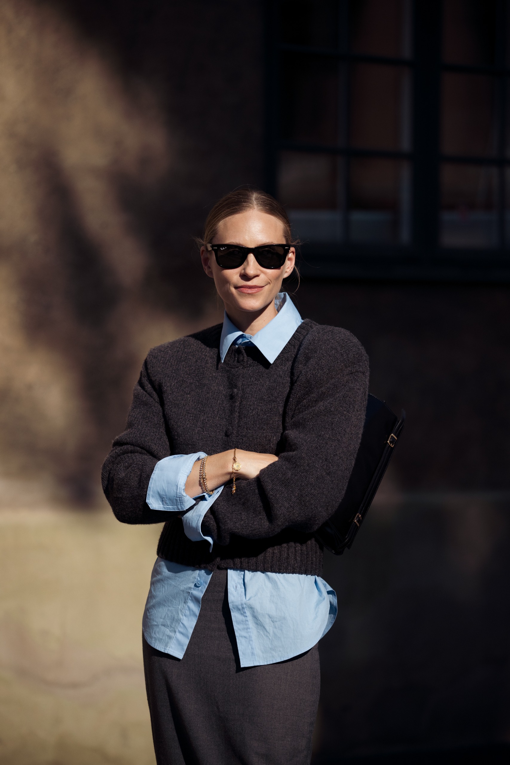 woman wearing grey cardigan sweater street style
