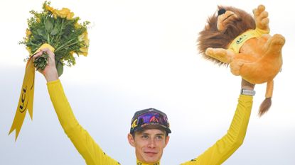 Overall winner Jonas Vingegaard on the podium after the final stage of the 2023 Tour de France