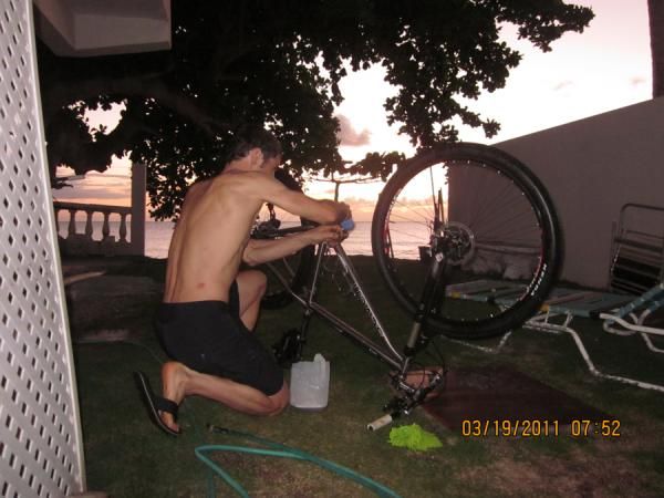 Mike Broderick gives the bikes a pre-race tune.