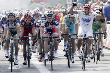 Danilo Napolitano (Acqua & Sapone) thinks he's won stage 1 at the Tour of Belgium, but the photo finish camera confirmed Andre Greipel (Lotto Belisol) took a narrow victory.