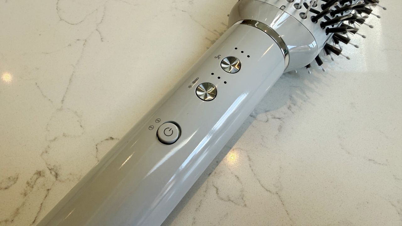 Close-up of the T3 Aire 360 controls showing the speed dial at the top, temperature dial in the middle and power button at the bottom