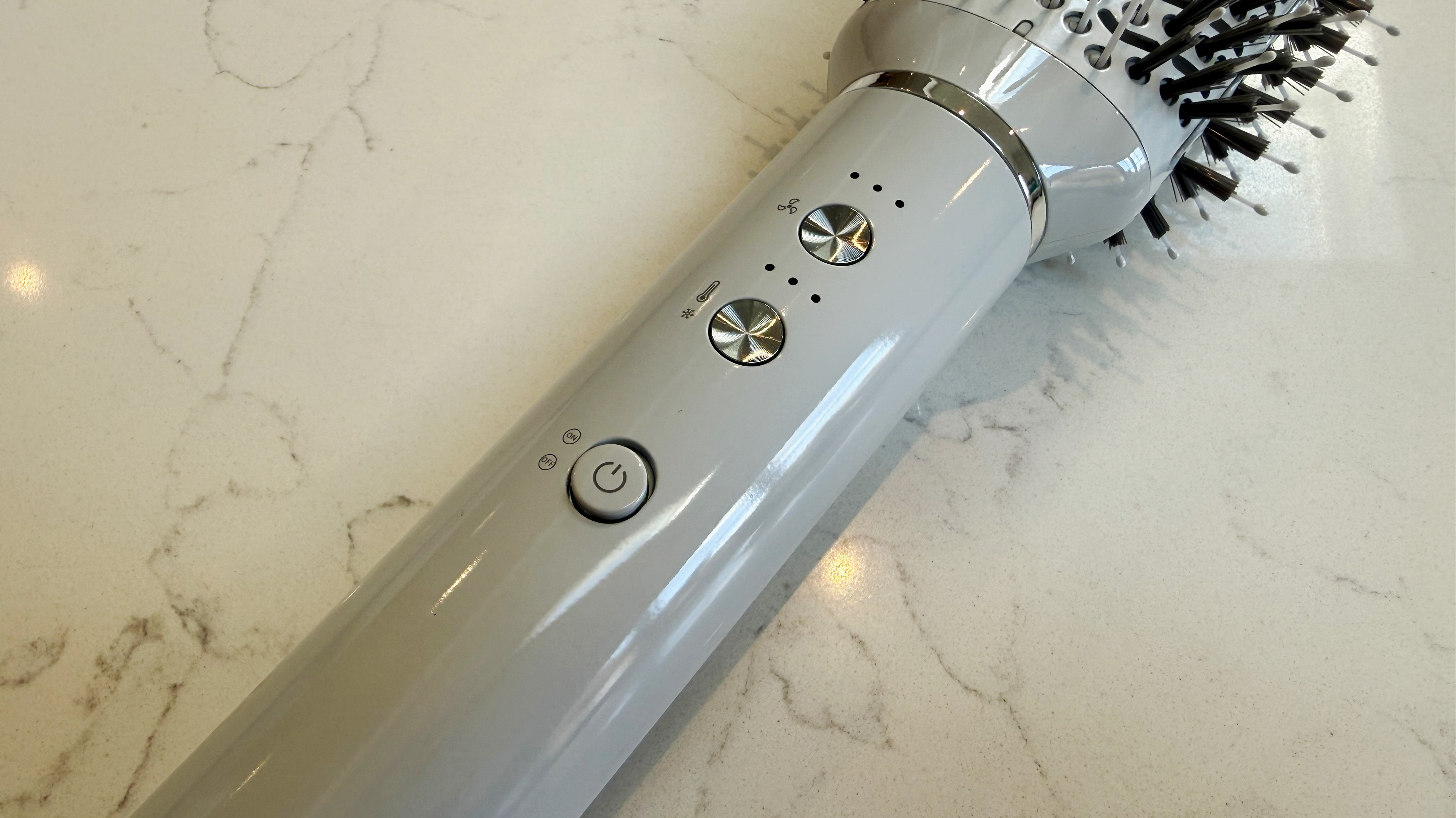 Close-up of the T3 Aire 360 controls showing the speed dial at the top, temperature dial in the middle and power button at the bottom