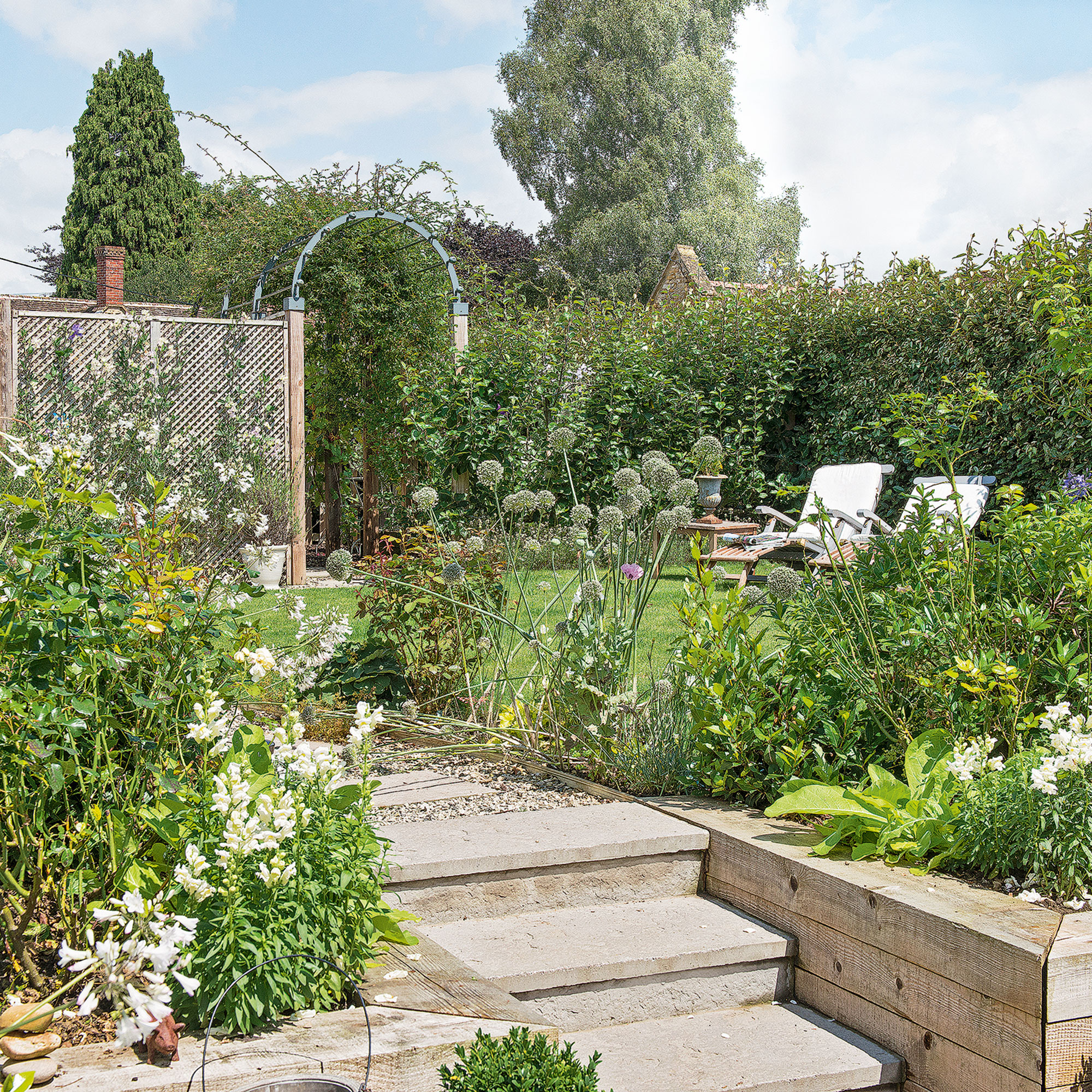 garden with white chair and lawn