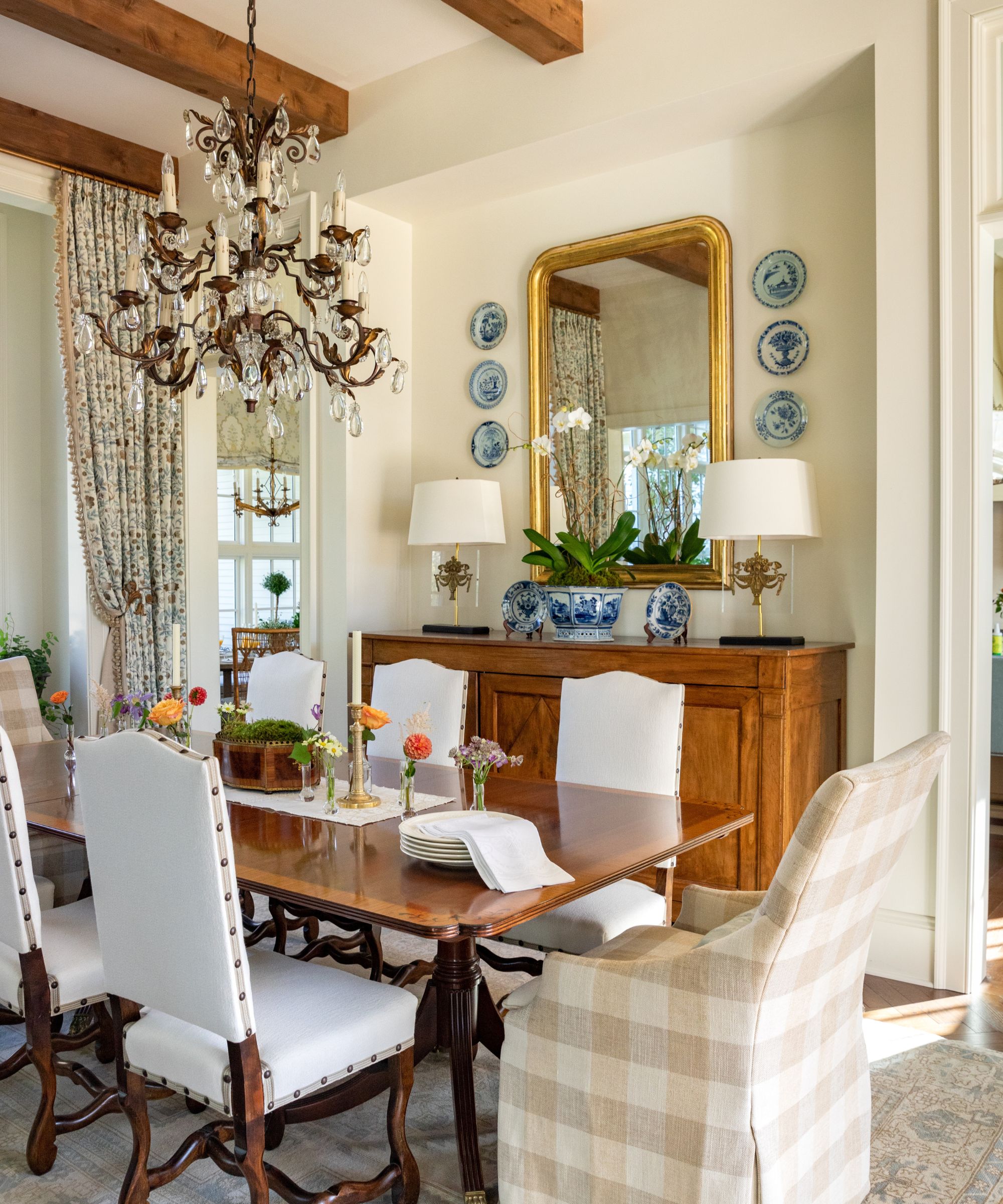 A neutral dining room with antique furniture