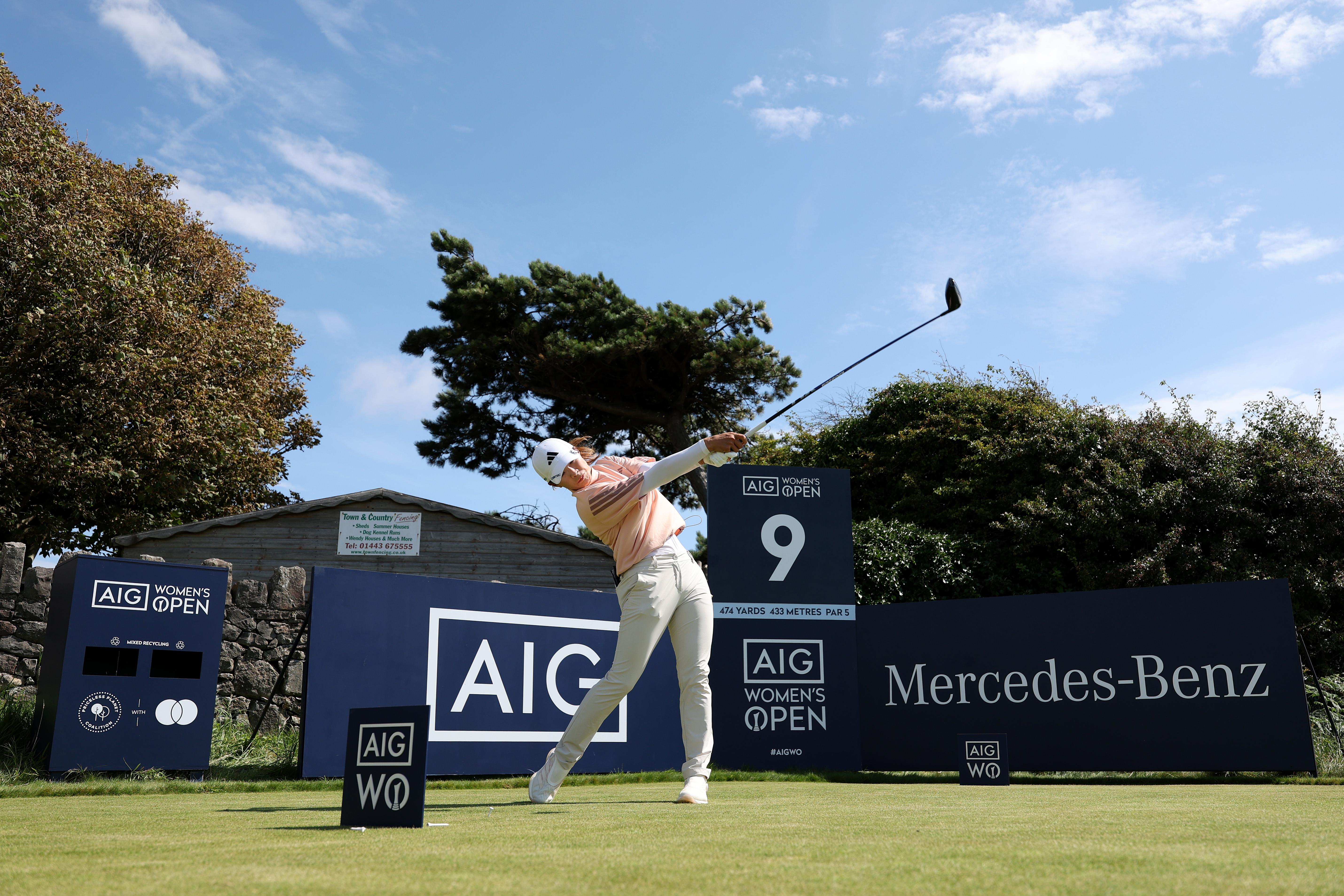 A golfer hits a tee shot