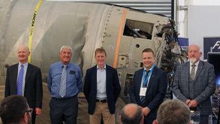 British astronaut Tim Peake (in the middle) with Skyrora CEO Volodymyr Levykin (second right) and other guests in front of the remnants of the Black Arrow rocket, which launched the Prospero satellite in 1971.