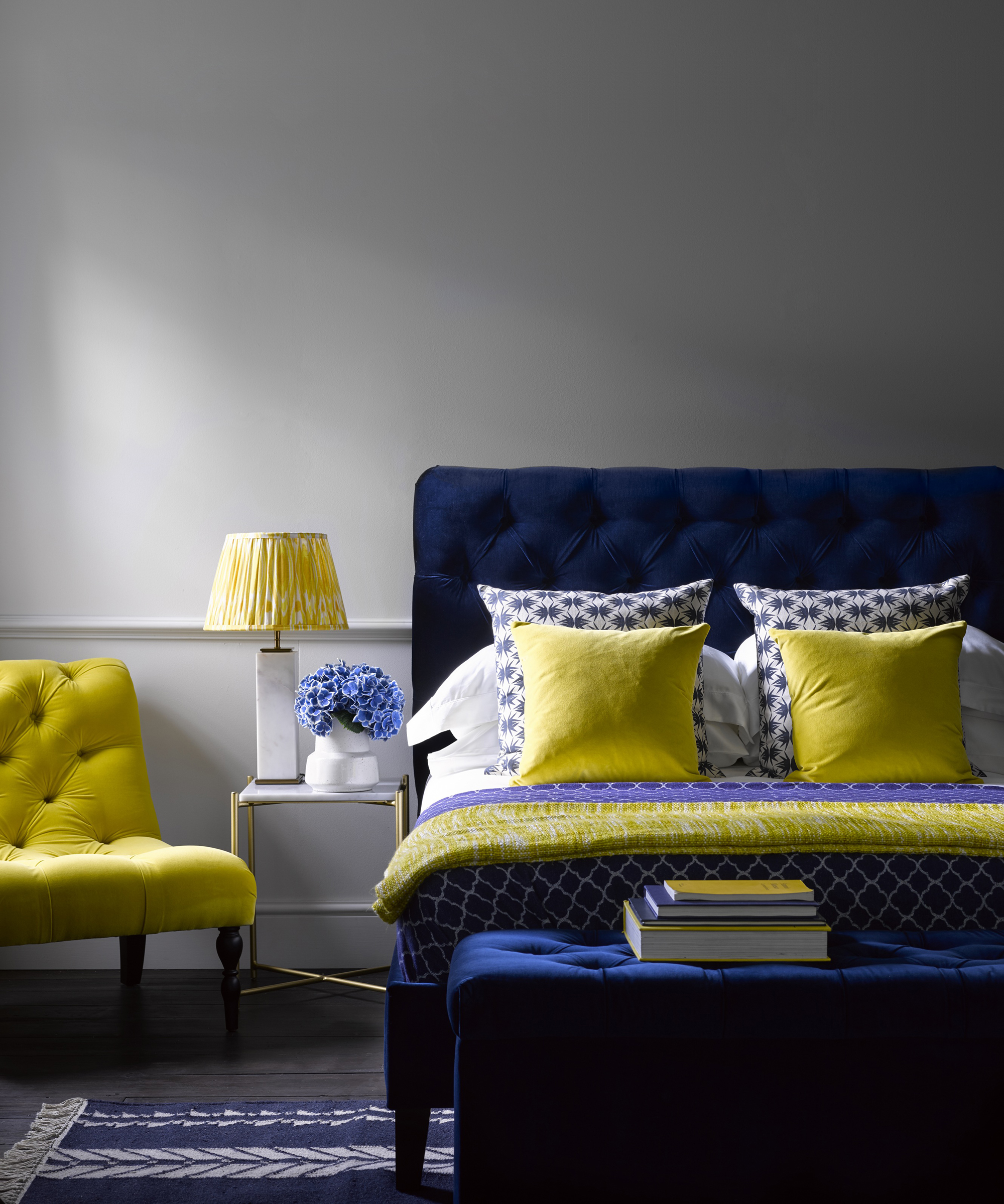 Navy blue and yellow bedroom decor by Sofa.com