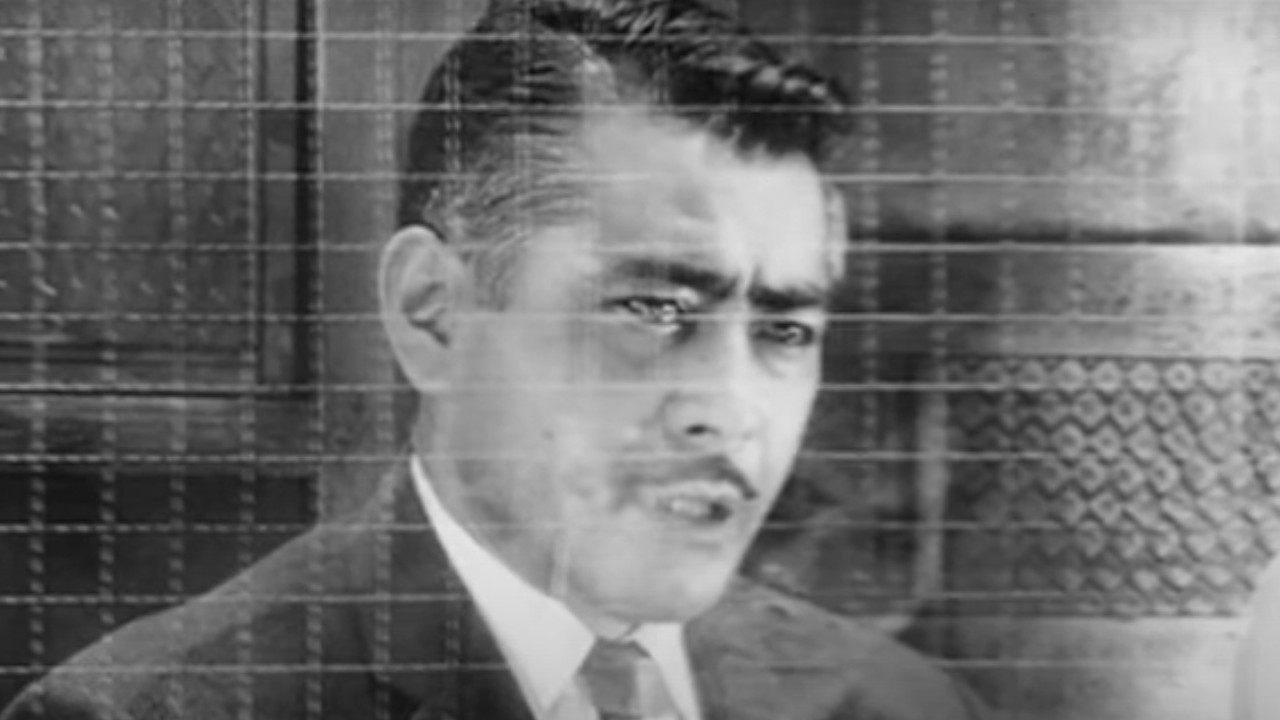 Toshiro Mifune questioning somebody in High and Low