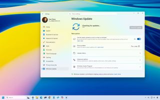 Windows 11 desktop with the Settings app on the Windows Update page.