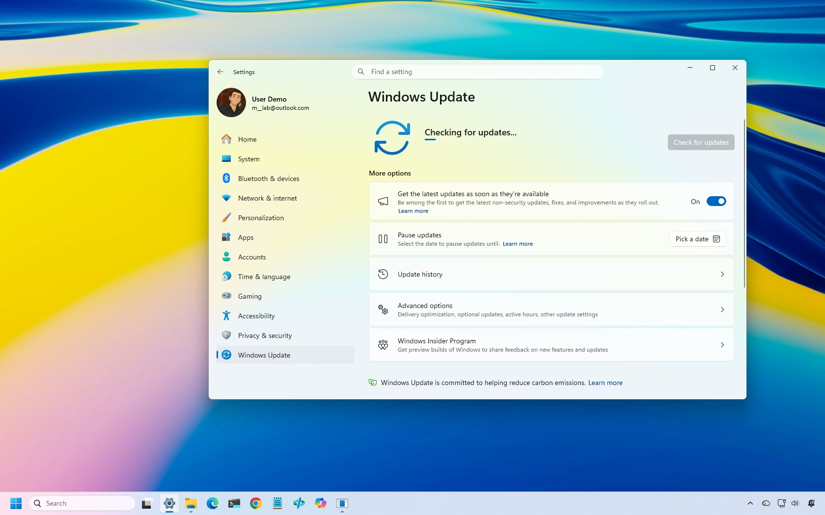 Windows 11 desktop with the Settings app on the Windows Update page.