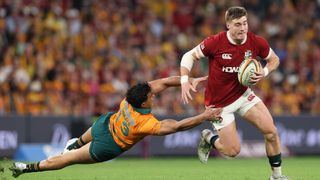 Tommy Freeman of British and Irish Lions gets past Joseph-Aukuso Suaalii of Australia during the 1st Test Match between Australia Wallabies and British & Irish Lions