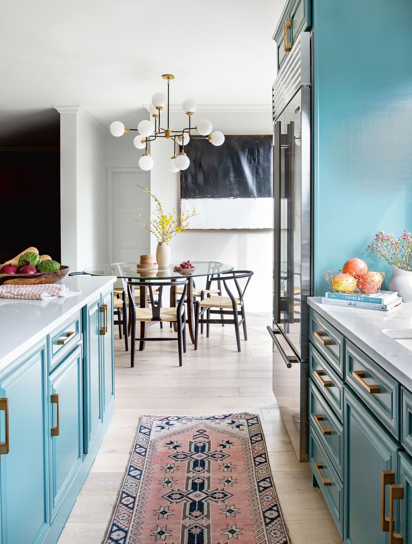 Kitchen styling with lighting in blue kitchen with runner
