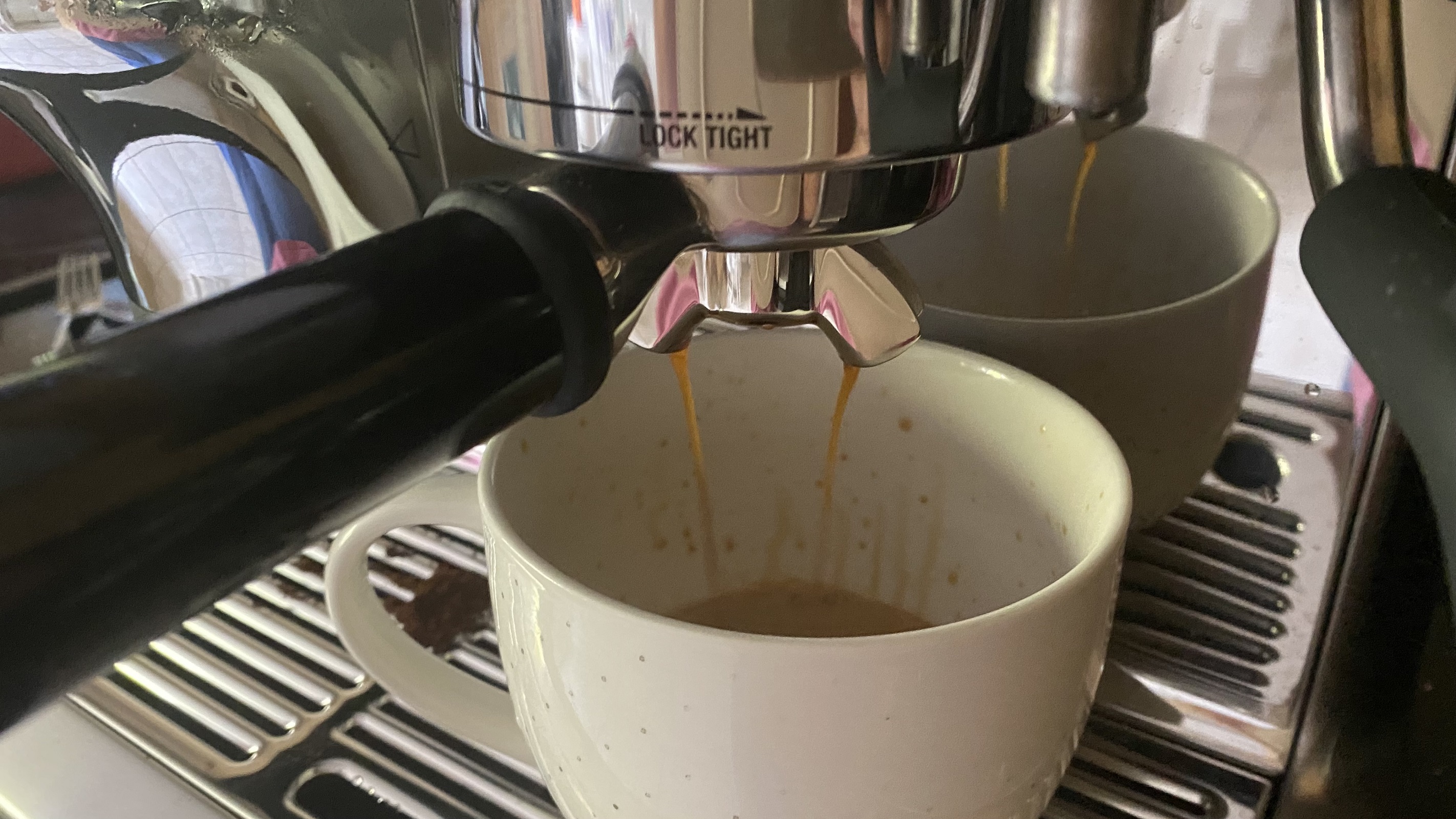 pouring an cappuccino using the new Barista Express Impress