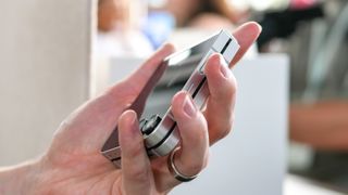 Samsung Galaxy Z Flip 7 FE held in the hand.