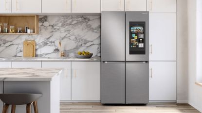 An elegant kitchen with marble splashback and fridge