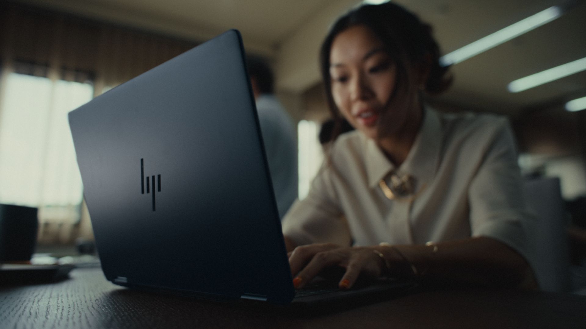 Employee using HP laptop in office