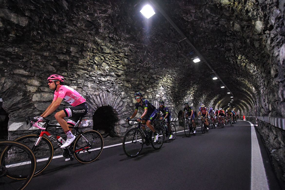 The peloton rides through a tunnel on stage 16 of the Giro d'Italia.