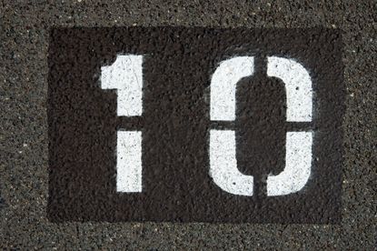 the number ten painted in white paint on asphault