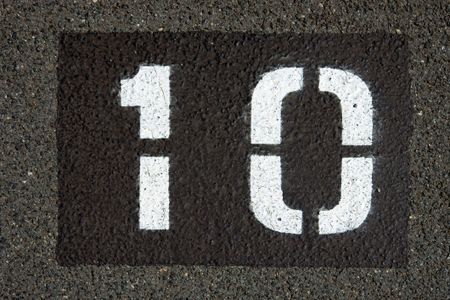 the number ten painted in white paint on asphault