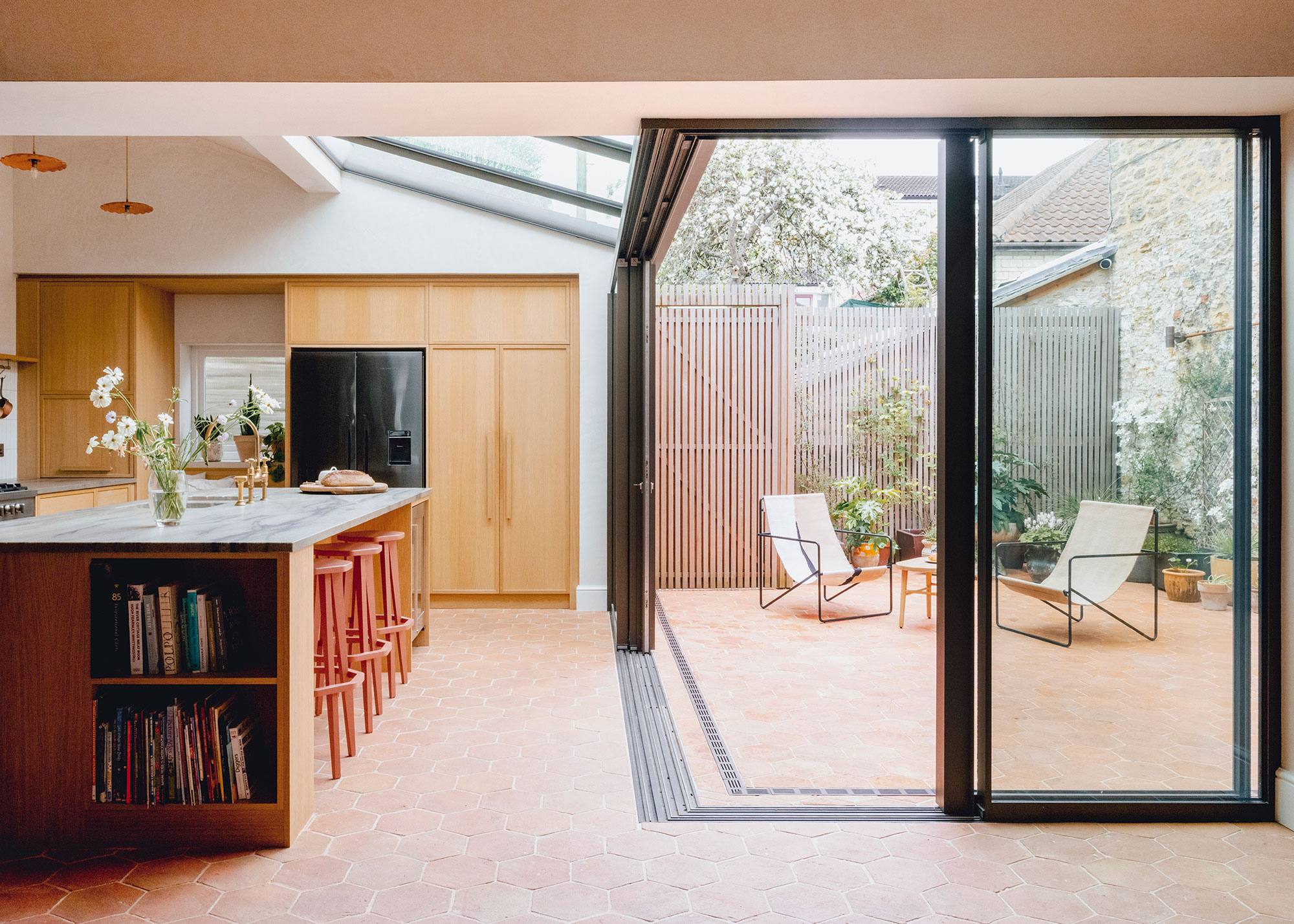 kitchen extension with sliding doors to small courtyard garden