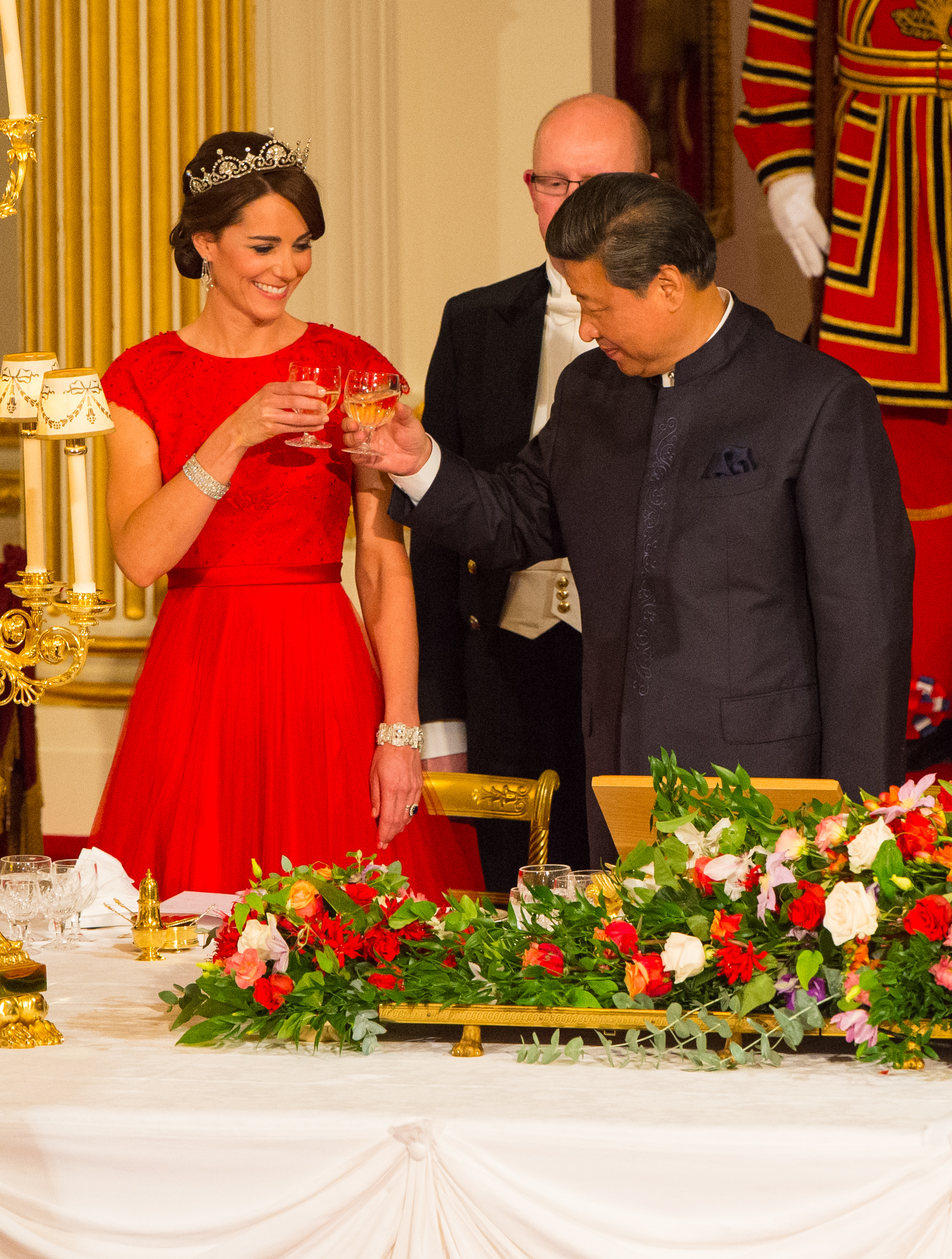 Princess Kate wearing a red gown toasting to Chinese President Xi Jinping in 2015.