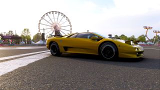 An image of the Lamborghini Diablo SV at the Horizon Festival Outpost in Forza Horizon 6. A big wheel fairground ride is in the background.