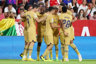 Eric Garcia of FC Barcelona celebrates scoring their side's third goal with teammates during the LaLiga Santander match between Sevilla FC and FC Barcelona at Estadio Ramon Sanchez Pizjuan on September 03, 2022 in Seville, Spain.