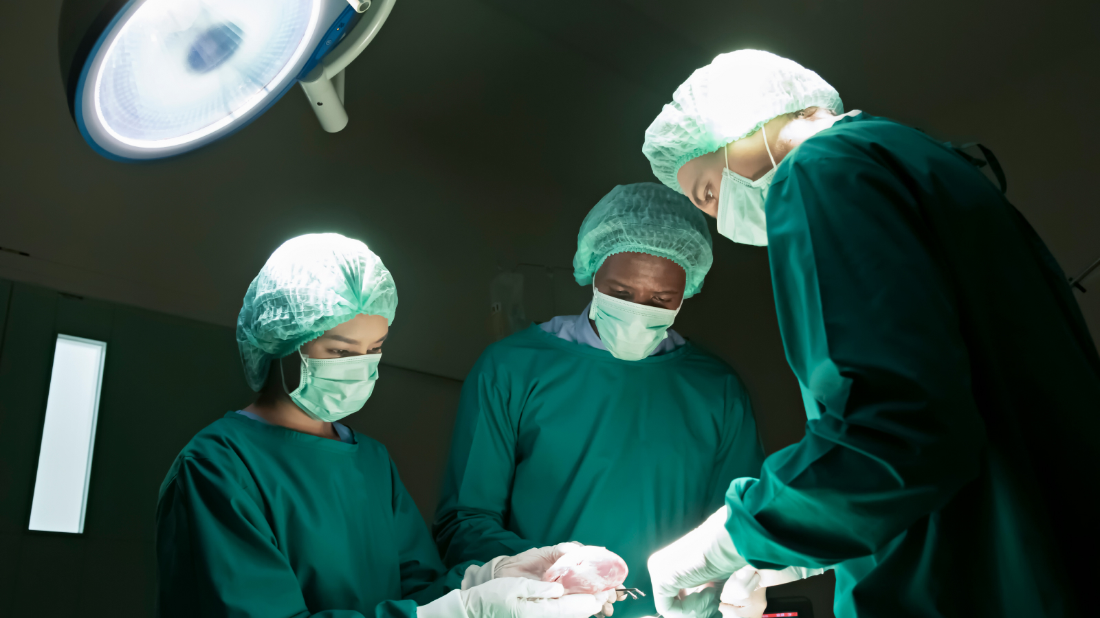 Surgeons carry out a cardiac transplantation for a patient.