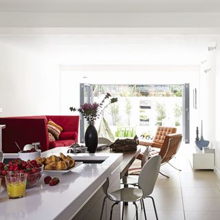 kitchen with white walls and table with chair