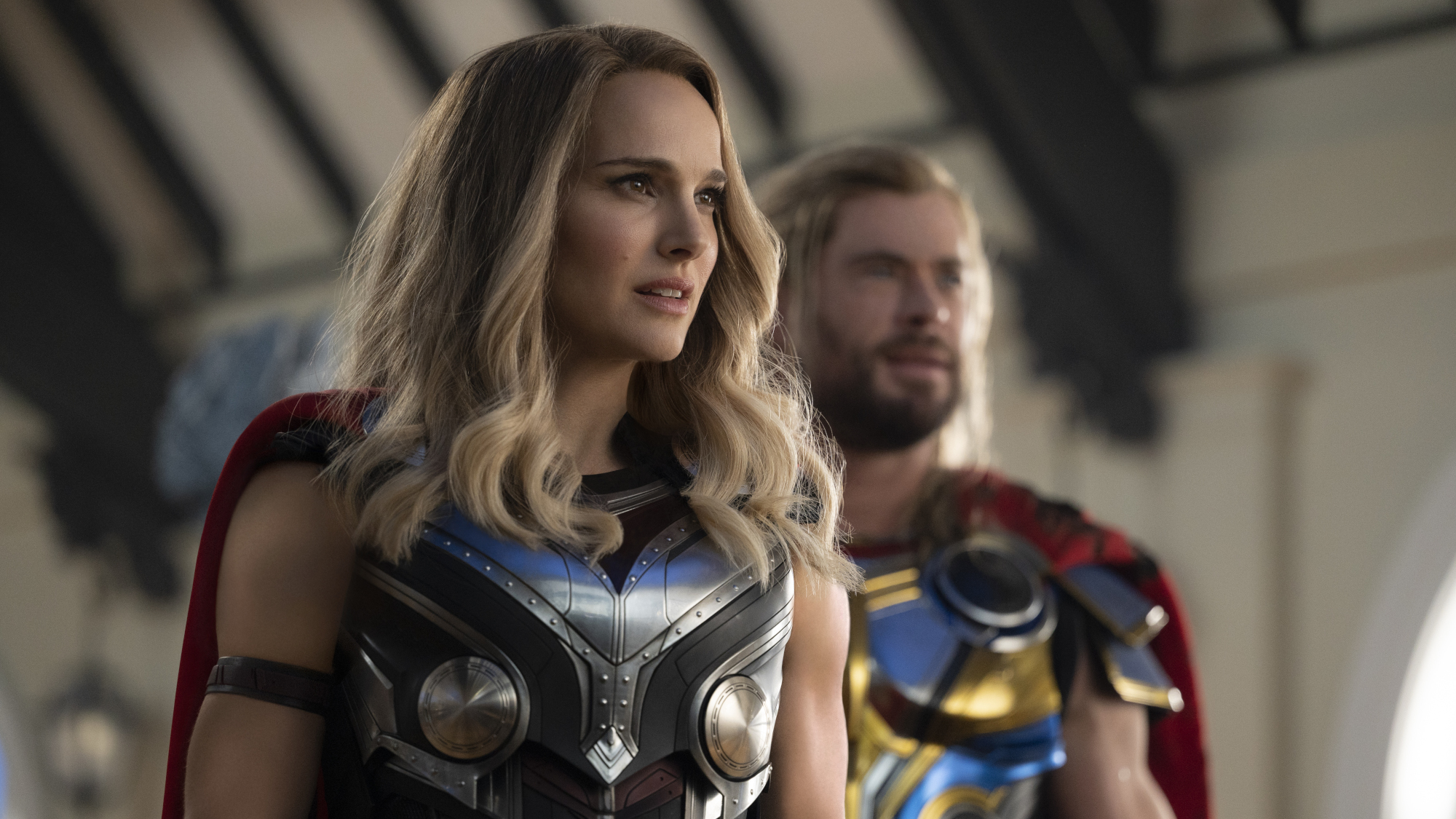 Jane Foster (Natalie Portman) and Thor (Chris Hemsworth) look over in Thor: Love and Thunder.