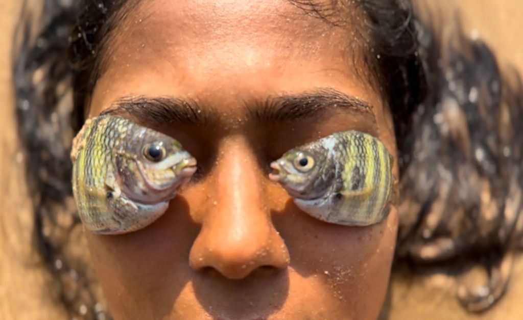 a person with fish on their eyes