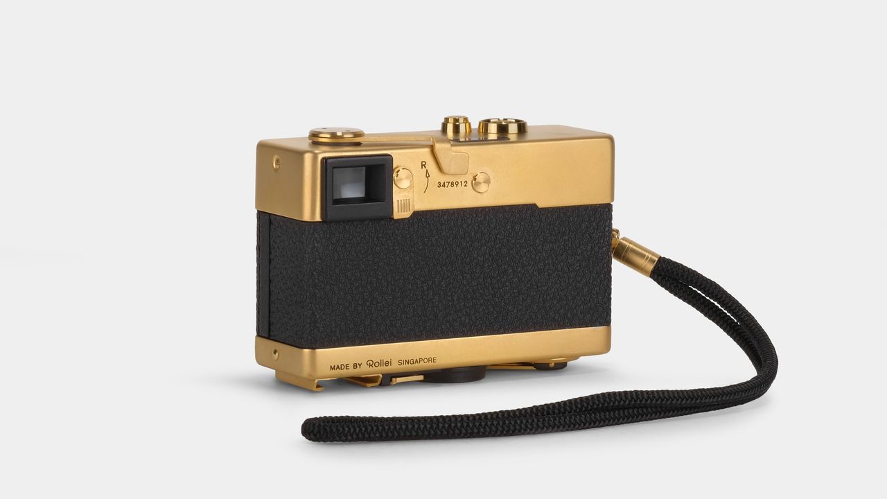 Rollei 35 Retrospekt 24K Gold Edition camera against a white background