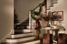 an entryway with a christmas garland