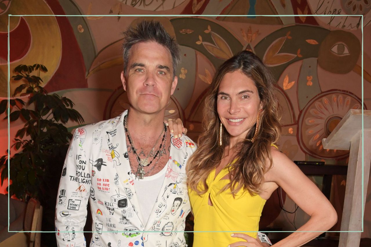 Robbie Williams and wife Ayda Field smiling