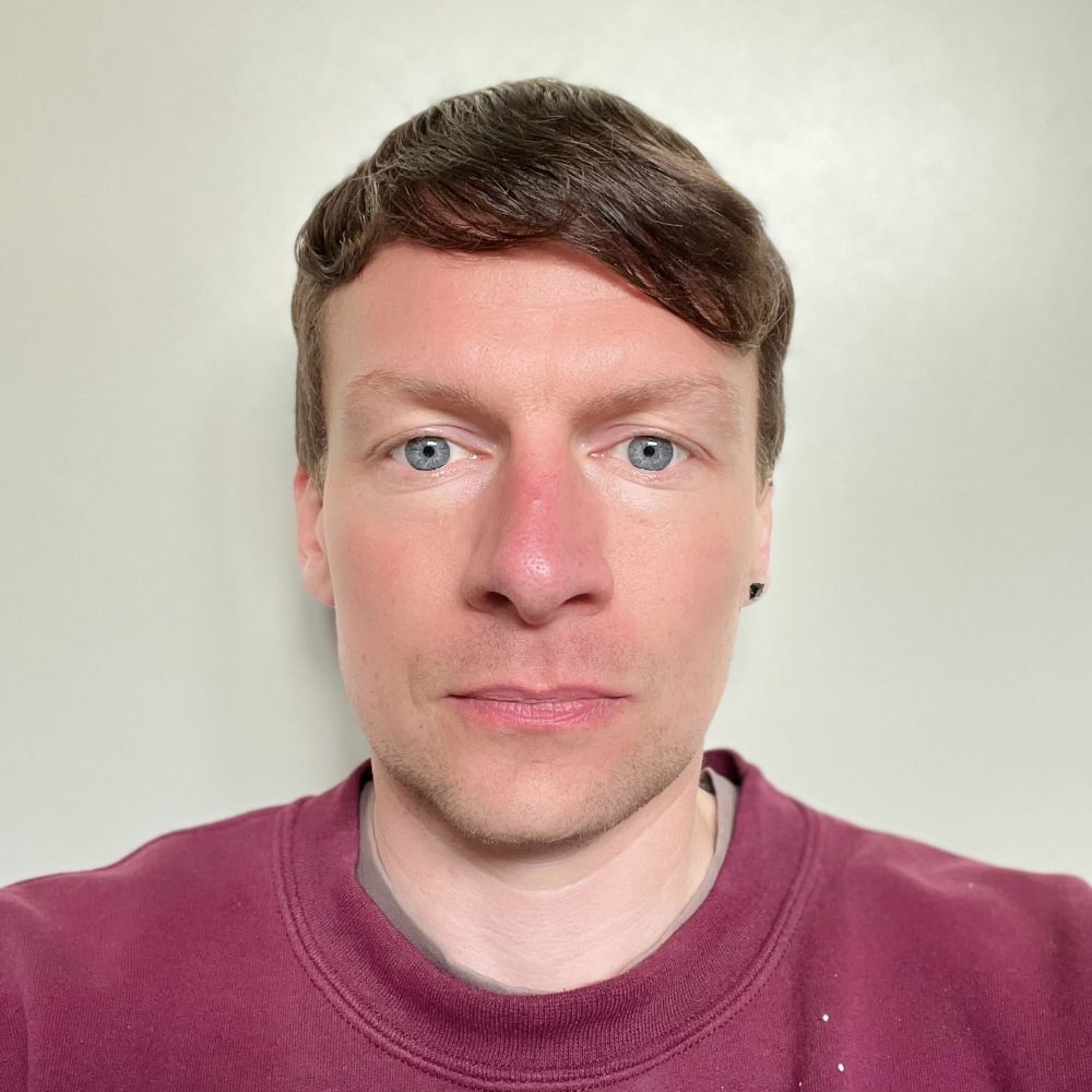 A headshot of Graham Matthews