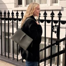 Shopping editor, Florrie, carries the Pol&egrave;ne Boky bag, wears a black blazer and blue jeans