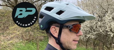 Side profile of man wearing Lazer Coyote KinetiCore mountain bike helmet