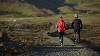 Couple running and biking together
