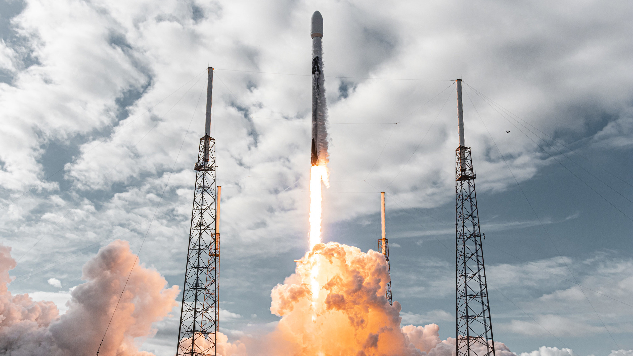 A SpaceX Falcon 9 rocket launches 143 small satellites into orbit from Cape Canaveral Space Force Station in Florida on Jan. 24, 2021 on the Transporter-1 rideshare mission.