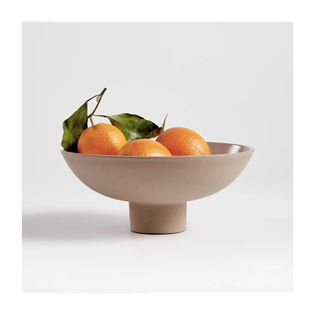 nude colored bowl with leg